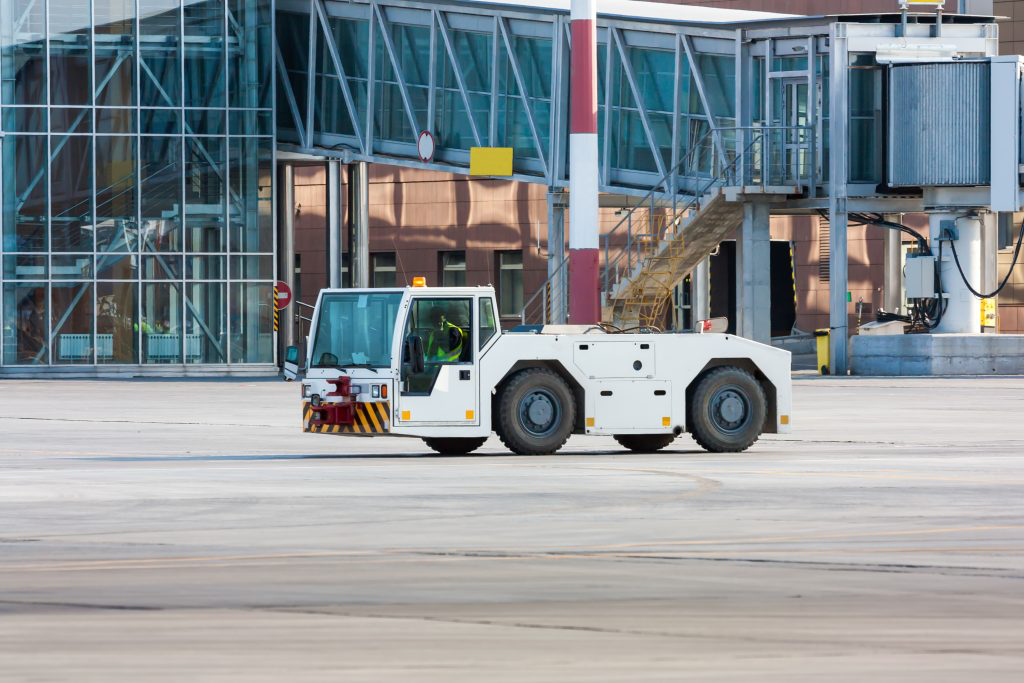 White airport ground support equipment vehicle.