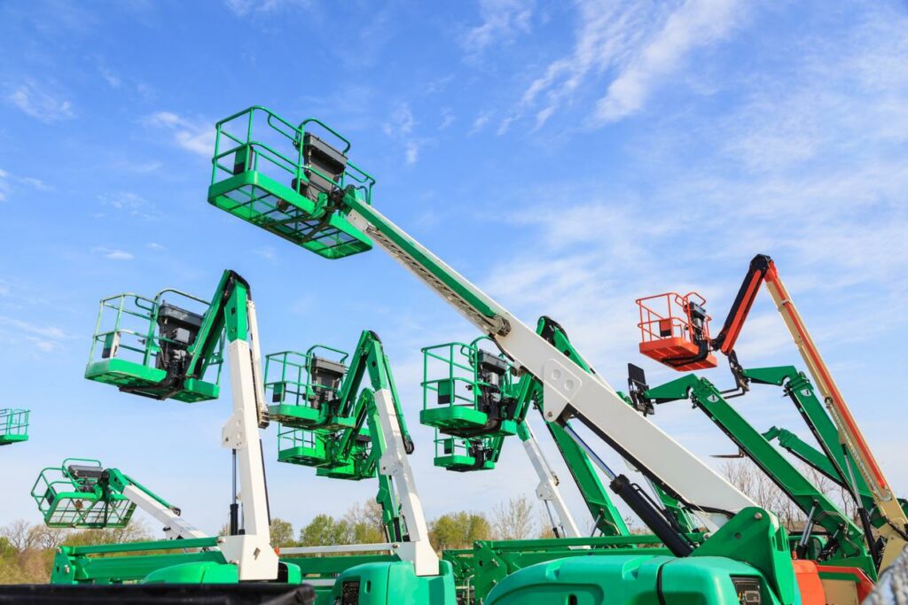 Group of green and red elevated work platforms.